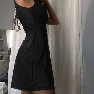 Black halter neck mini dress with a v-back